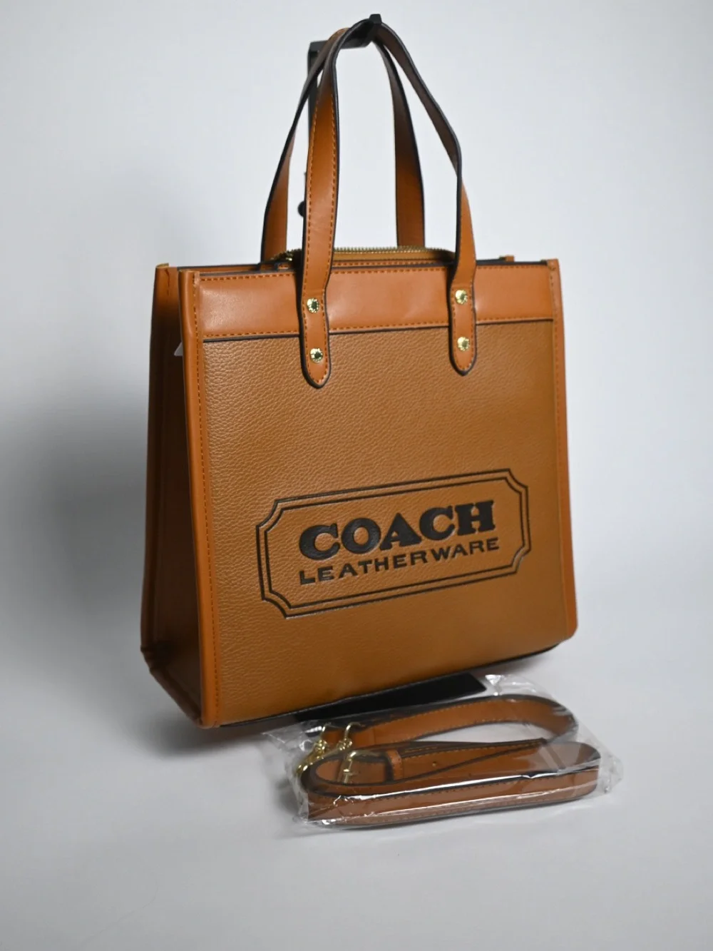 Coach Tan Pebbled Leather Logo Tote with Charm